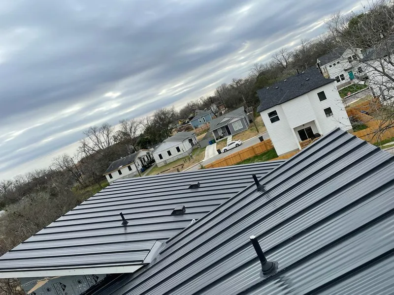 Standing seam metal roof panels with vents for Skylight Repair in Gunbarrel